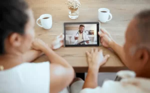 couple telehealth doctor and tablet videocall