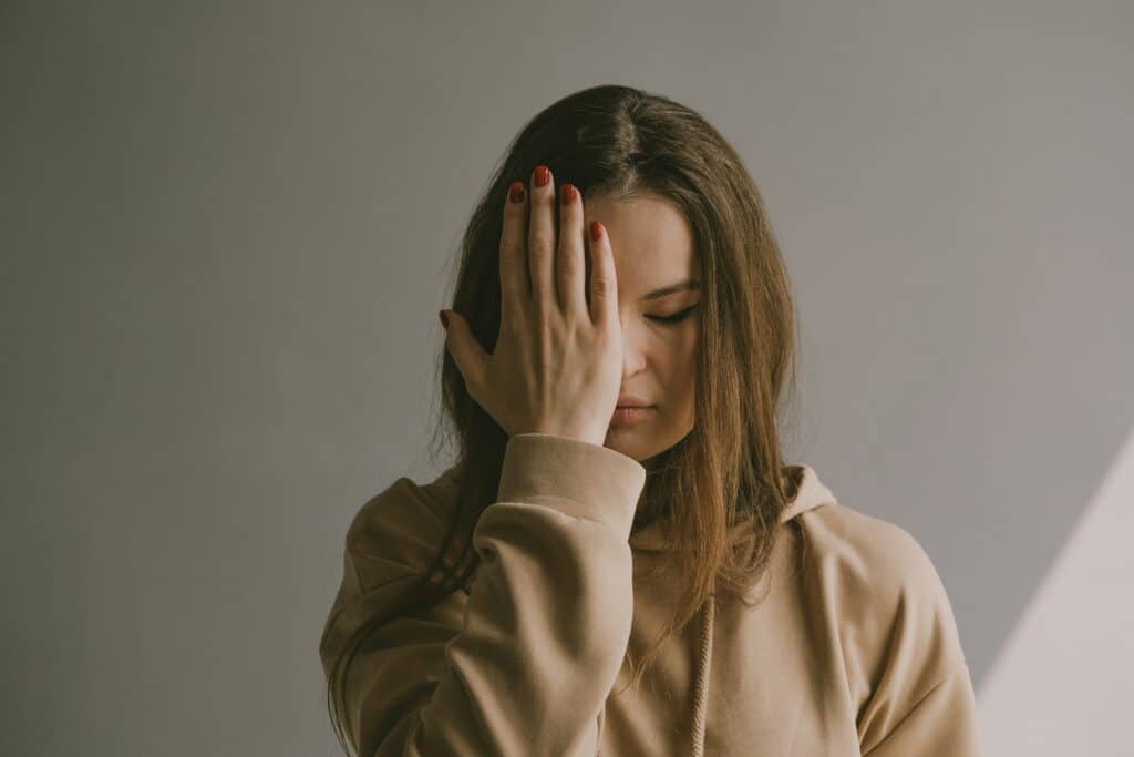 A woman reflecting quietly, symbolizing mental health support and care for depression at Ventana Mental Health