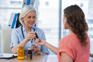 Illustrative stock photo: Representative clinician discussing medicine with a patient
